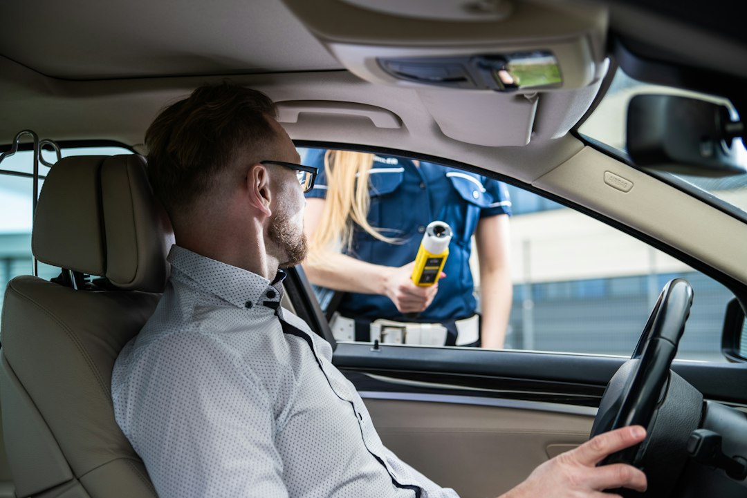Police breathalyser test for drink driving enforcement in Spain